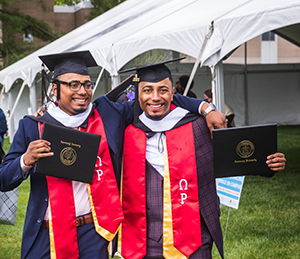 Two young men celebrating their graduation